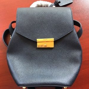 Mini blue leather TUMI backpack